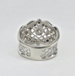 Silver lattice-patterned ring on white background.