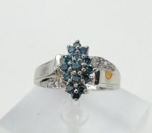 Silver ring with blue gemstone cluster.