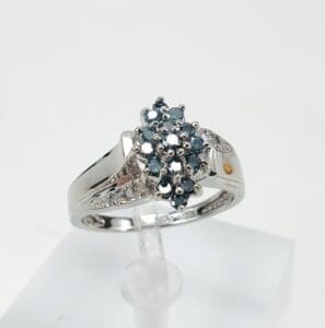 Silver ring with blue gemstone cluster.