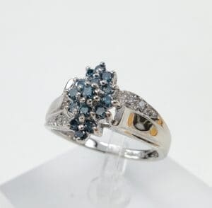Silver ring with blue gemstone cluster.
