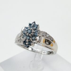 Silver ring with blue gemstone cluster.