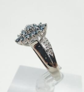 Silver ring with blue gemstone cluster.