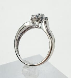 Silver engagement ring with diamond setting.
