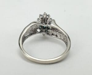 Silver ring with a decorative setting.