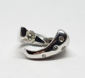 Silver ring with diamond accents.