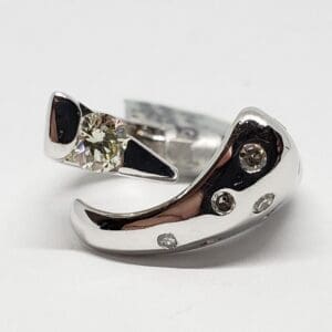 Silver ring with embedded diamonds.
