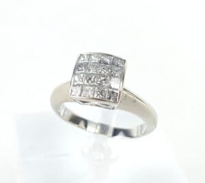 Silver ring with square diamond cluster setting.