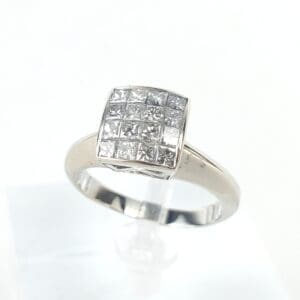 Silver ring with square diamond cluster setting.
