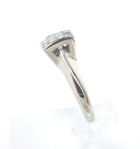 Silver ring with square-cut clear stones.