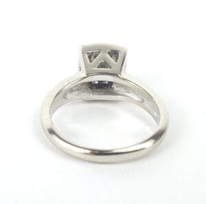 Silver ring with geometric setting design.