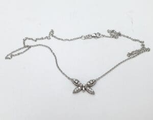 Butterfly pendant necklace with delicate chain.
