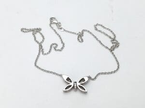 Butterfly pendant necklace on silver chain.
