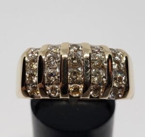 Gold ring with multiple rows of diamonds.
