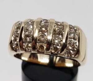 Gold ring with multiple sparkling diamonds.
