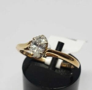 Gold ring with a single diamond stone.