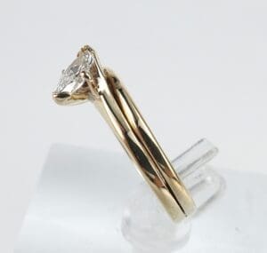 Gold engagement ring with diamond solitaire.
