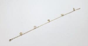 Gold bracelet with heart charms.