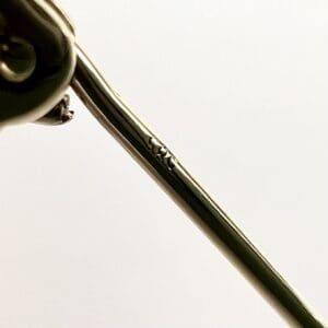 Close-up of a metal spoon handle.