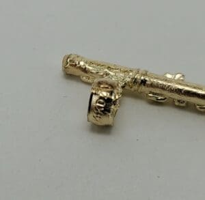 Golden key on a plain surface.
