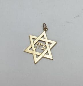 Gold Star of David pendant with inscription.