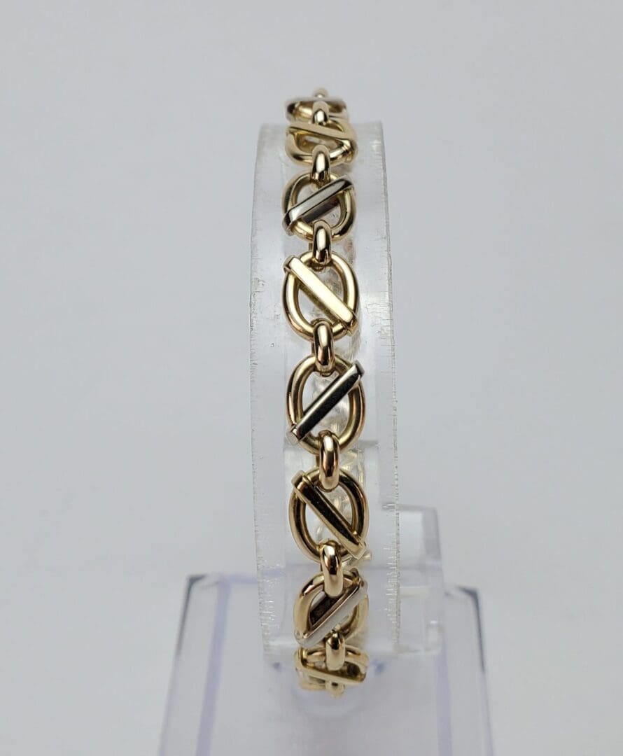 Gold and black decorative link bracelet.