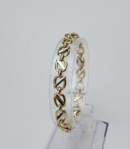 Gold bracelet with chain link design.