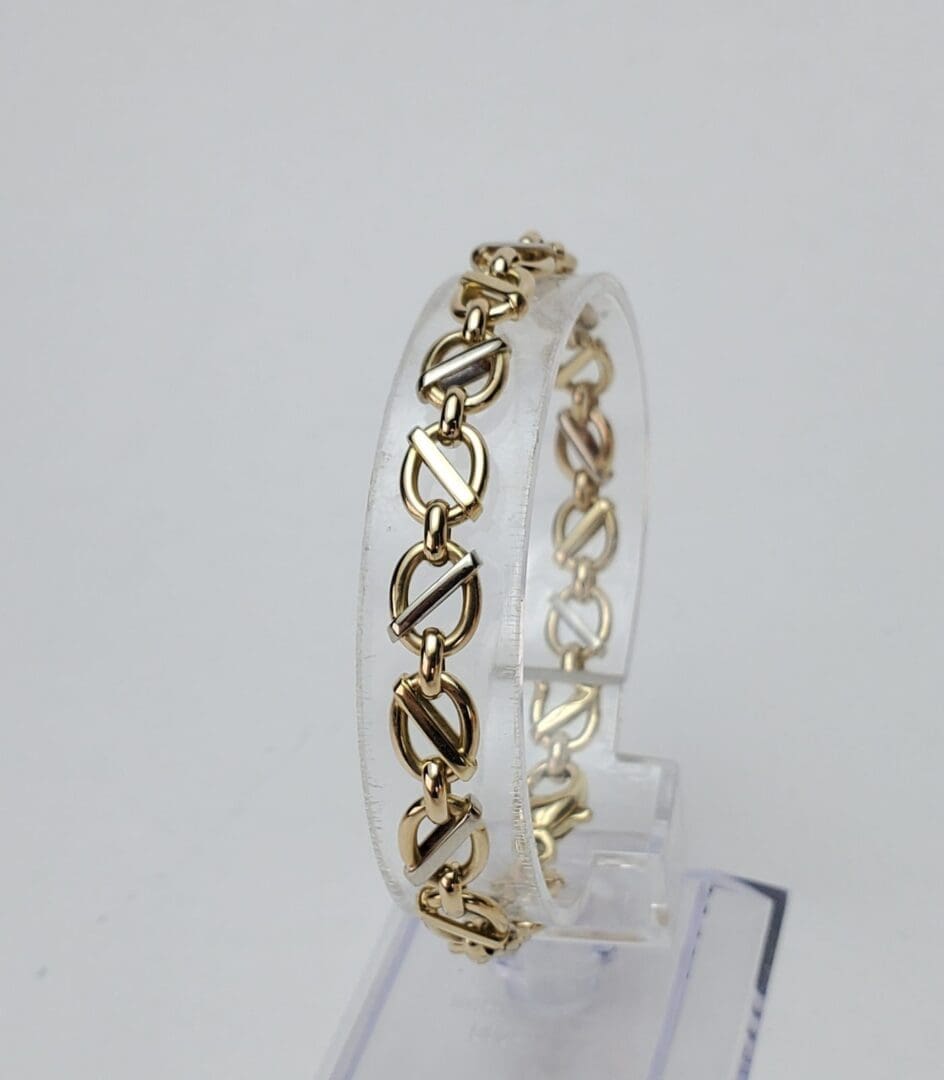 Gold bracelet with chain link design.