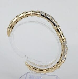 Gold and silver bracelet with diamond accents.