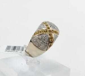 Gold and silver ring with gemstones.