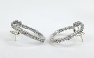 Silver hoop earrings with sparkling stones.
