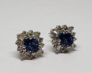 Blue gemstone earrings with diamond accents.