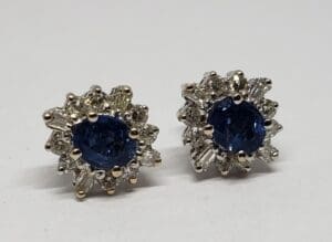 Blue gemstone earrings with diamond accents.