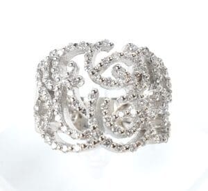 Ornate silver ring with intricate detailing.