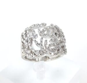Ornate silver ring with intricate design.