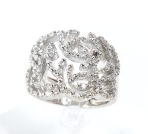 Silver ornate ring with small diamonds.