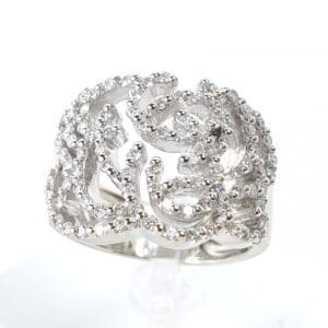 Silver ornate ring with small diamonds.