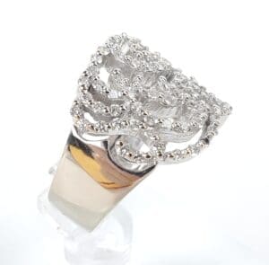 Silver ring with intricate, textured design.
