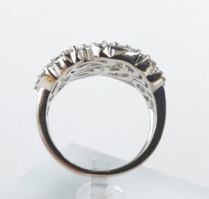 Silver ring with small diamonds, side view.
