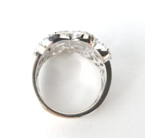 Silver ring with gemstone setting, side view.