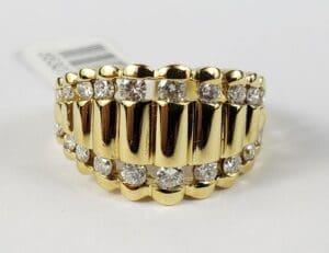 Gold and diamond grillz with barcode tag.