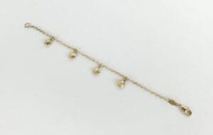Gold bracelet with shell-shaped charms.