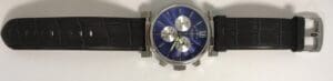 Blue dial wristwatch with black leather strap.