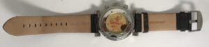 Wristwatch with leather strap, back view.