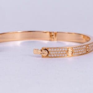 Gold bracelet with diamond accents.