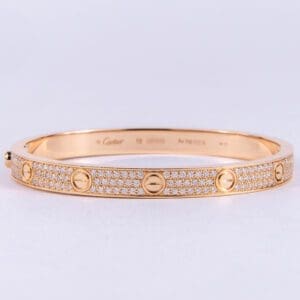 Gold bracelet with diamond accents.