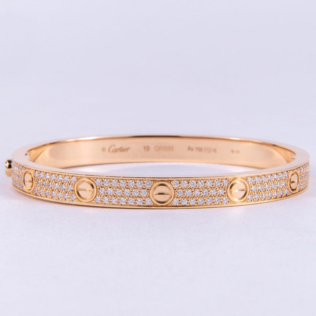 Gold bracelet with diamond accents.