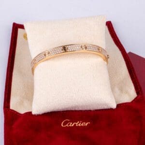 Gold bracelet in red Cartier box.