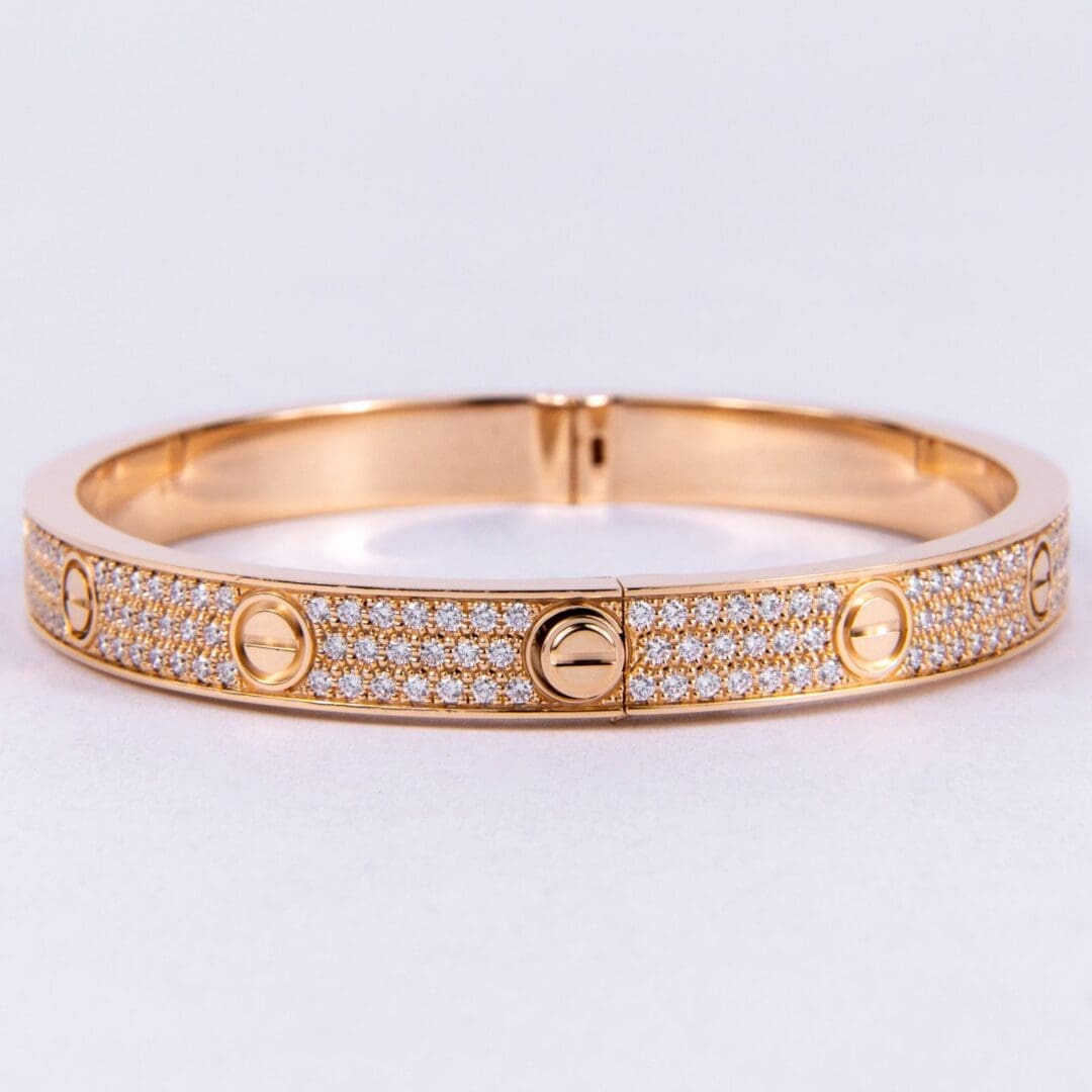 Gold bracelet with diamond accents.