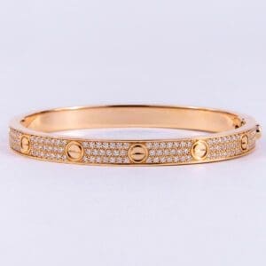 Gold bracelet with diamond accents.