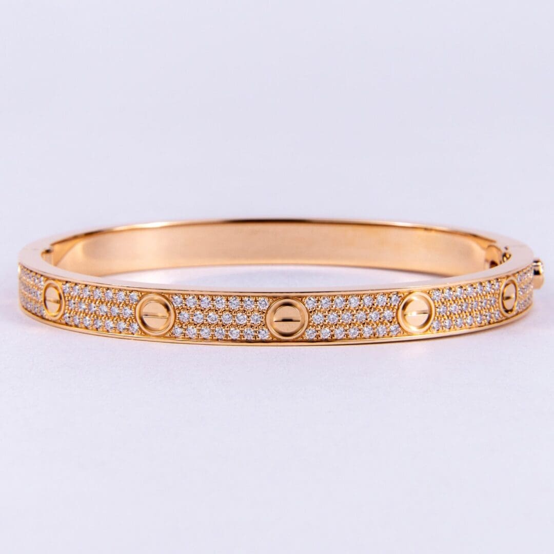 Gold bracelet with diamond accents.